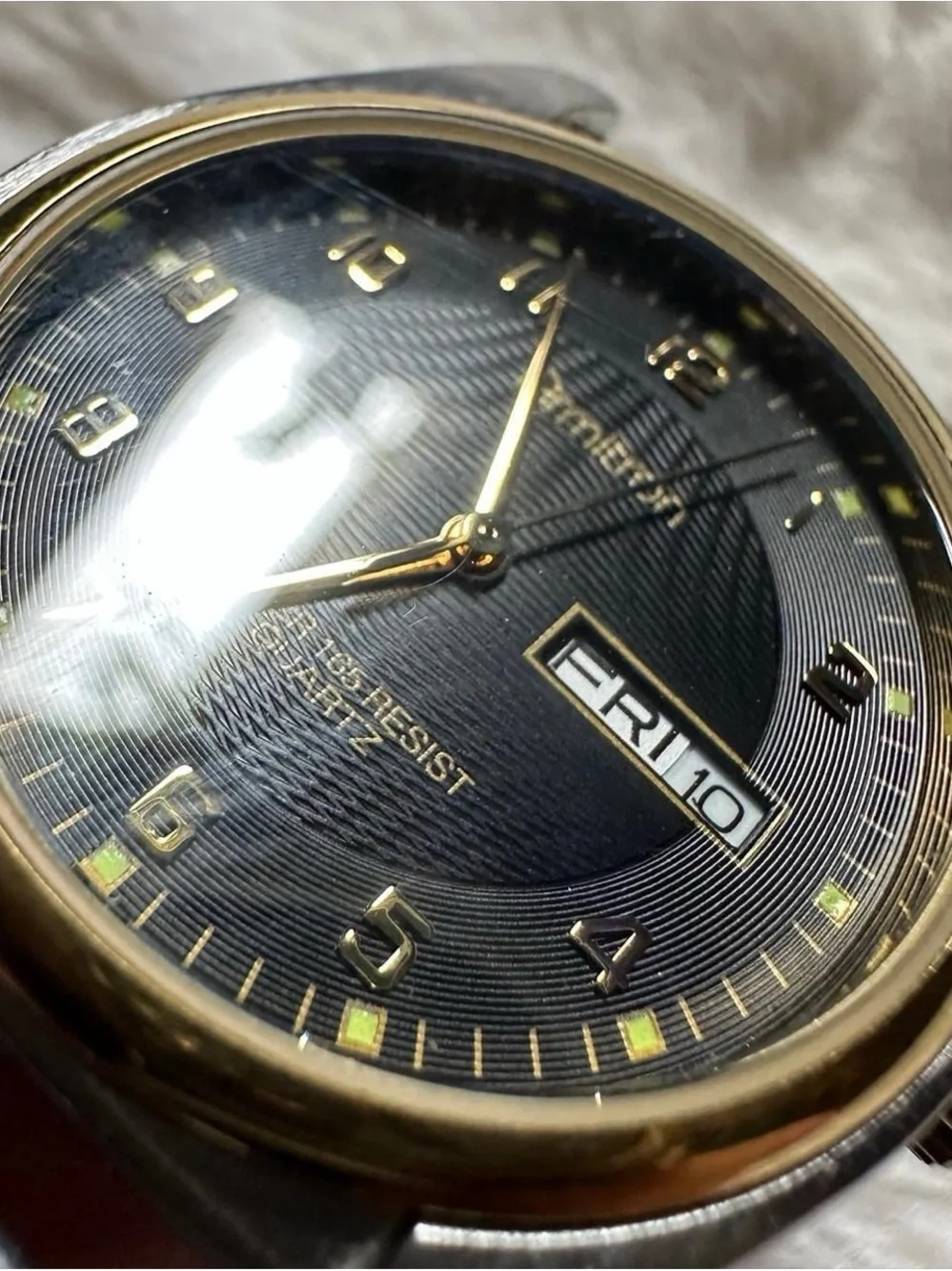 Vintage Armitron Black and Gold Men's Analog Quartz Watch with Day-Date